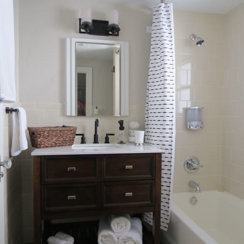 Combined shower/tub, hair dryer, towels, soap