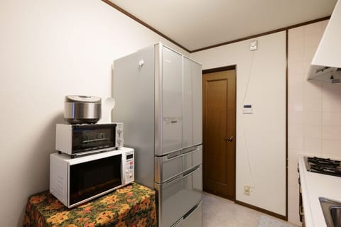 Fridge, microwave, cookware/dishes/utensils