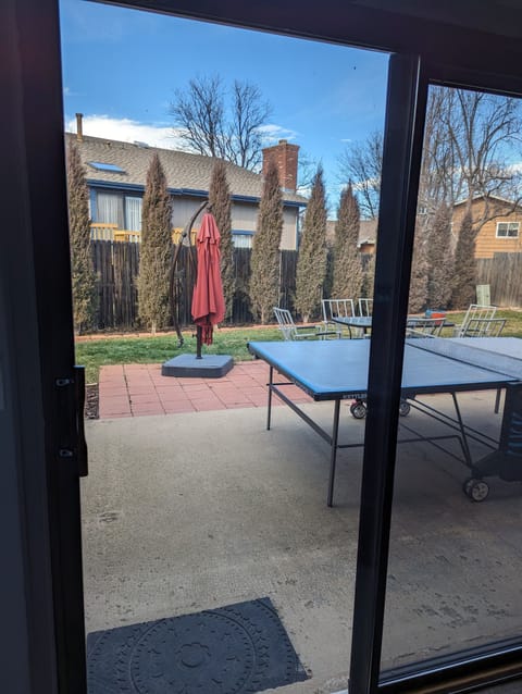 Back patio with outdoor ping pong table