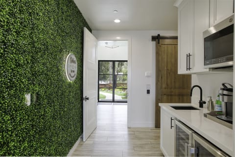 Cobboo's Beach House instagram wall and kitchenette