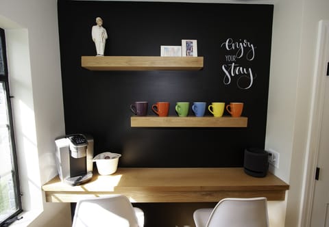 Breakfast bar with Keurig, outlets with USB ports, and Echo Studio Speaker.
