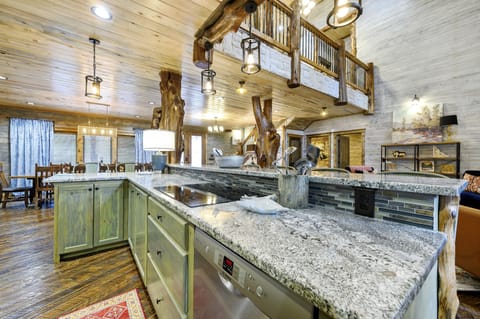 Kitchen is equipped with dual stovetops, two dishwashers and ample counter space