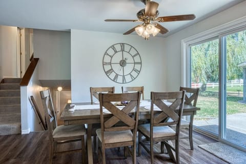 Adjacent to the kitchen, the dining area offers a large table with seating for the whole family, making it the perfect spot for shared meals and conversations.