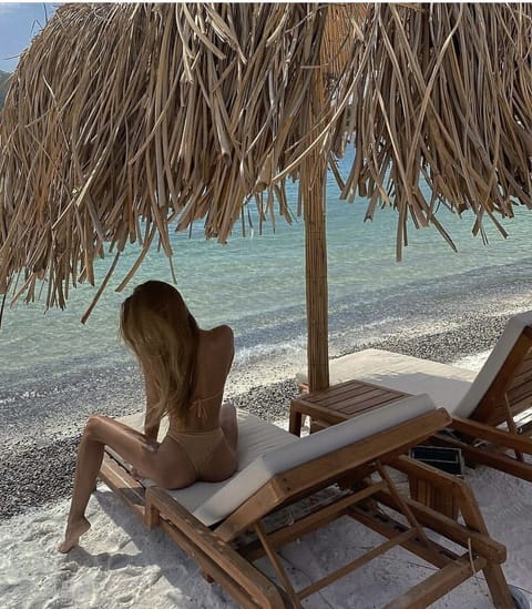 On the beach, sun loungers, beach towels