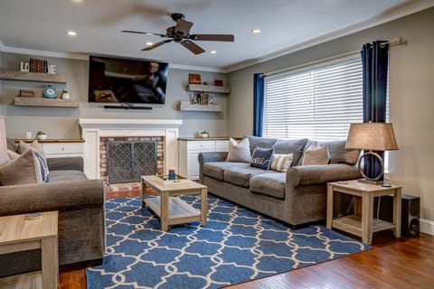 Livingroom:  65" Smart TV, 2 couches 