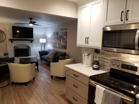 Open kitchen & living area. 55" Smart tv that is connected to Firecast
