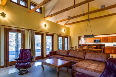 Step out from the living room out to covered deck with brand new BBQ grill