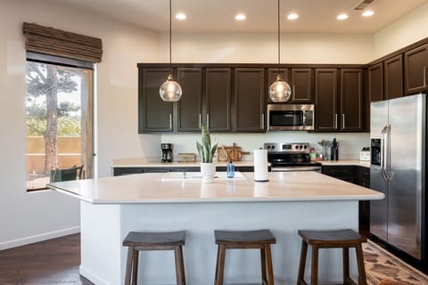 Fully Equipped Kitchen with Island Seating for Three