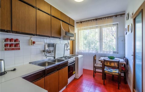 Fridge, stovetop, dishwasher, coffee/tea maker