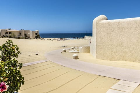 On the beach, sun loungers, beach towels