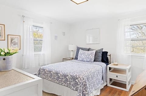 Downstairs bedroom with full bed and desk