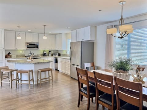 The nearby dining area offers plenty of seating for the whole crew — perfect for beachside meals and making lasting memories together.