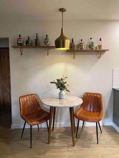 Whiskey bottles displayed above for a fun accent wall