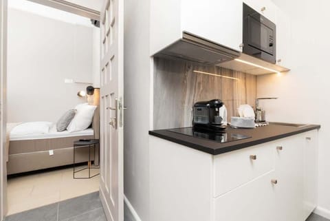 The fully equipped kitchenette includes everything you need for a home-cooked meal.