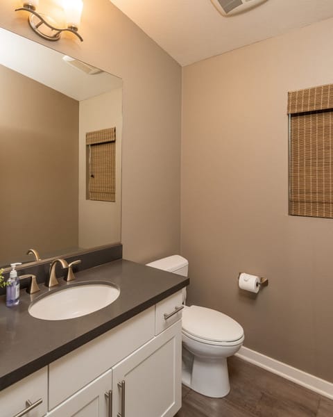 The main living space has a private powder room just off the kitchen.