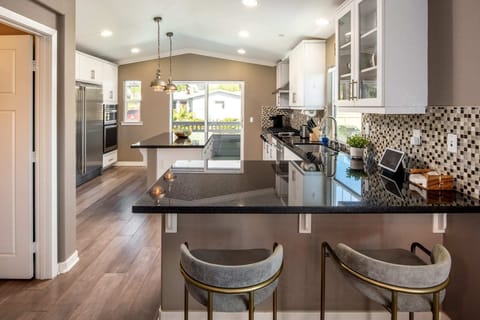 Built-in cabinetry and an oversized fridge and freezer add a luxurious feel to the kitchen.