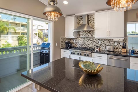 Coffee-lovers and cooks alike will appreciate the professional-grade gas range along with the Keurig and Nespresso machines and grill like a pro on the outdoor BBQ.