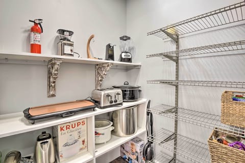 Walk-in Pantry has small appliances and plenty of shelving for your food items