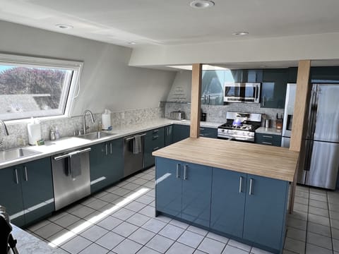 Bright double Kitchen (2 of everything) with ocean views. 2nd Stove off the left