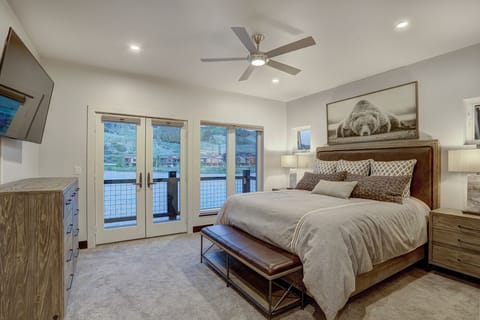 Master Bedroom Upstairs: Balcony, water   & mountain views, king bed, bench.
