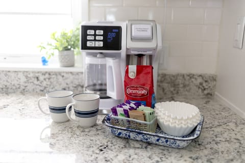 Coffee service in kitchen to the right of the sink