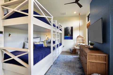 Bright and playful bunk bedroom, this custom-built bunk room is perfect for kids or guests.