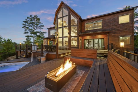 From the sunken hot tub to the fire table to the eating area, our cabin's massive deck has plenty of room for your entire group to relax and have fun!