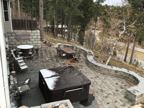 View from upper patio. Full lower level patio deck and hot tub