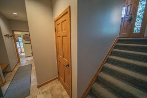 Hallway to downstairs bedrooms and game room!