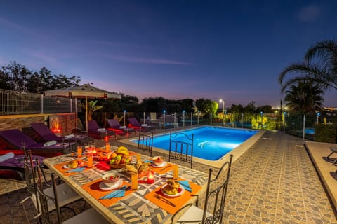 Outdoor pool, a heated pool, sun loungers