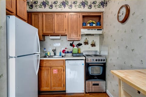 Fully stocked kitchen with fridge, stove, microwave, dishwasher, & coffee makers
