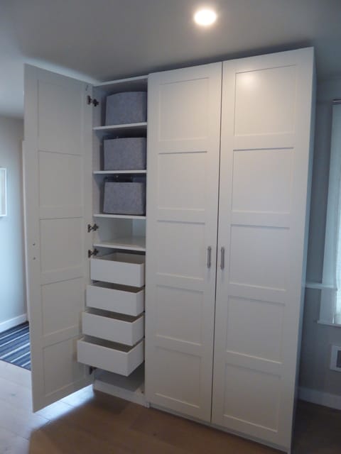 Spacious wardrobe for guest storage of clothing and personal items