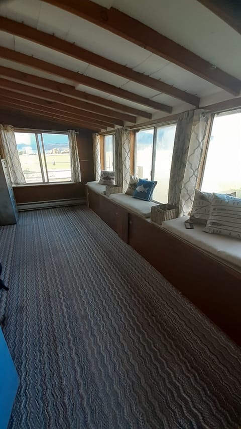 Back porch.  Great for putting in fishing gear, supplies and storage area