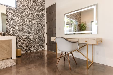 Makeup vanity with lighted mirror