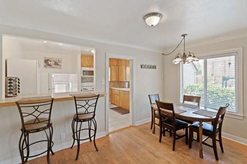 Bright dining area with views of both the kitchen and living room.