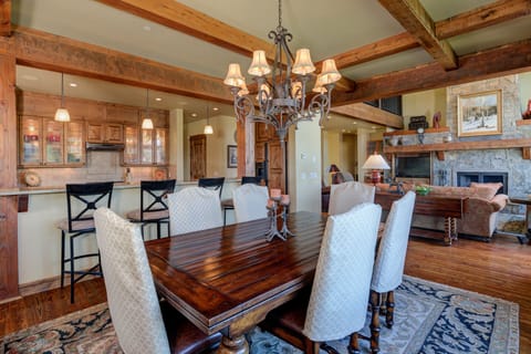 Dining table seats up to 6 guests, with additional 4 seats at the kitchen island.