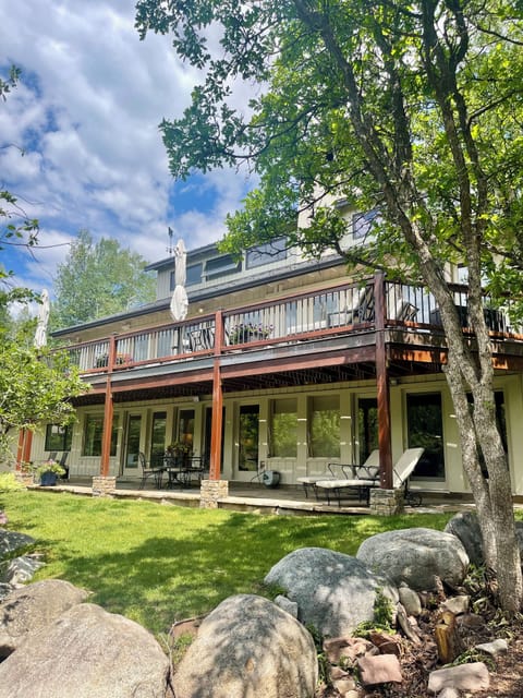 Lower patio & yard accessible from downstairs primary, guest & living room