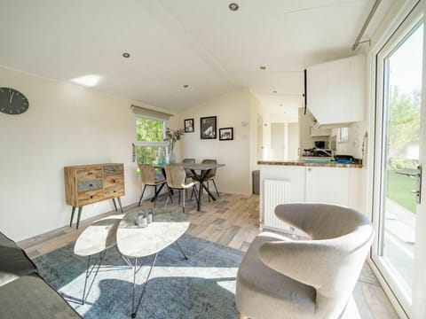 Azure, Chair, Plant, Living Room, Interior Design, Flooring, Wood, Floor, Building, Real Estate