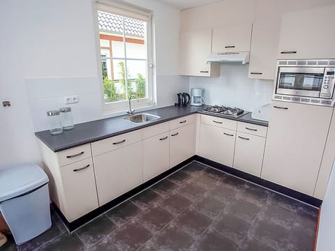 Kitchen, Cabinetry, Countertop, Kitchen Appliance, Flooring, Major Appliance, Kitchen Sink, Interior Design, Drawer, Plumbing Fixture