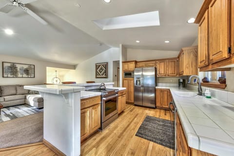 The kitchen is spacious and equipped with new stainless steel appliances