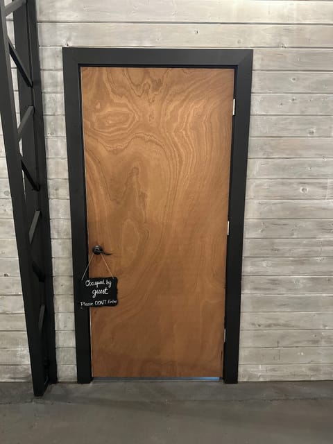 Door in main barn area to private suite