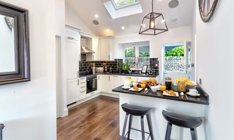 Stylish Kitchen with Breakfast Bar & Stable Door leading to the Outside Area.