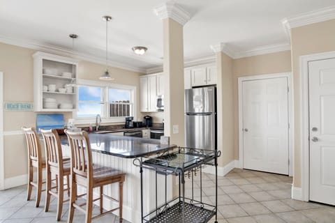 The kitchen offers stainless appliances and granite counters