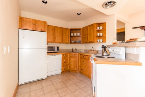 Downstairs pool room features an additional kitchen.