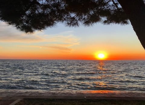 The beautiful sunset as seen from the beach of Villa Rita