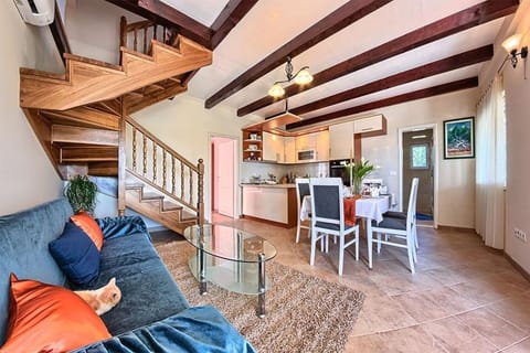 Seating area next to the dining table and kitchen on the ground floor of the villa for luxury vacation and rent