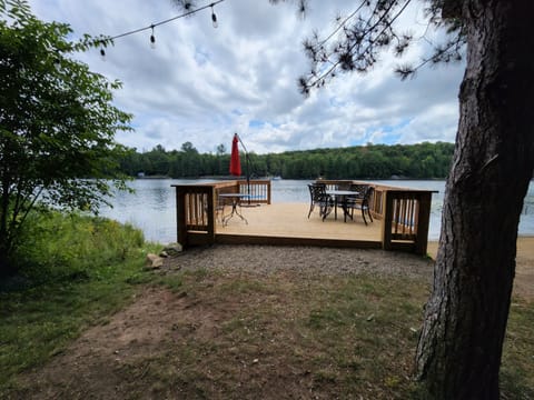 16'x16' deck on the edge of the lake with  patio set