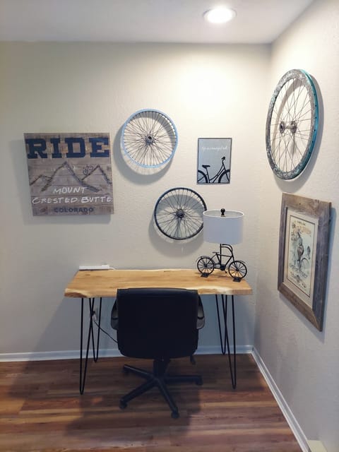 One of two dedicated workspaces are in the Loft, has comfortable chair.