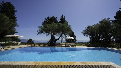 A heated pool, sun loungers