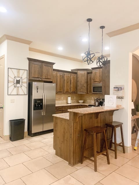 Fully stocked kitchen with table settings for 12